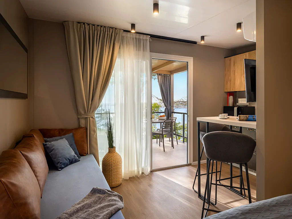 lanterna_premium_camping_resort_punto_blu_premium_village_view_from_the_mobile_home_bedroom
