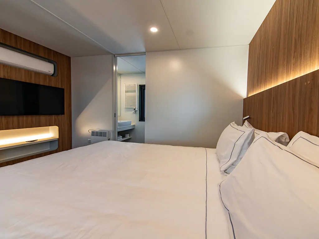 camping-stoja-deluxe-camping-villa-interior-bedroom-details-double-bed