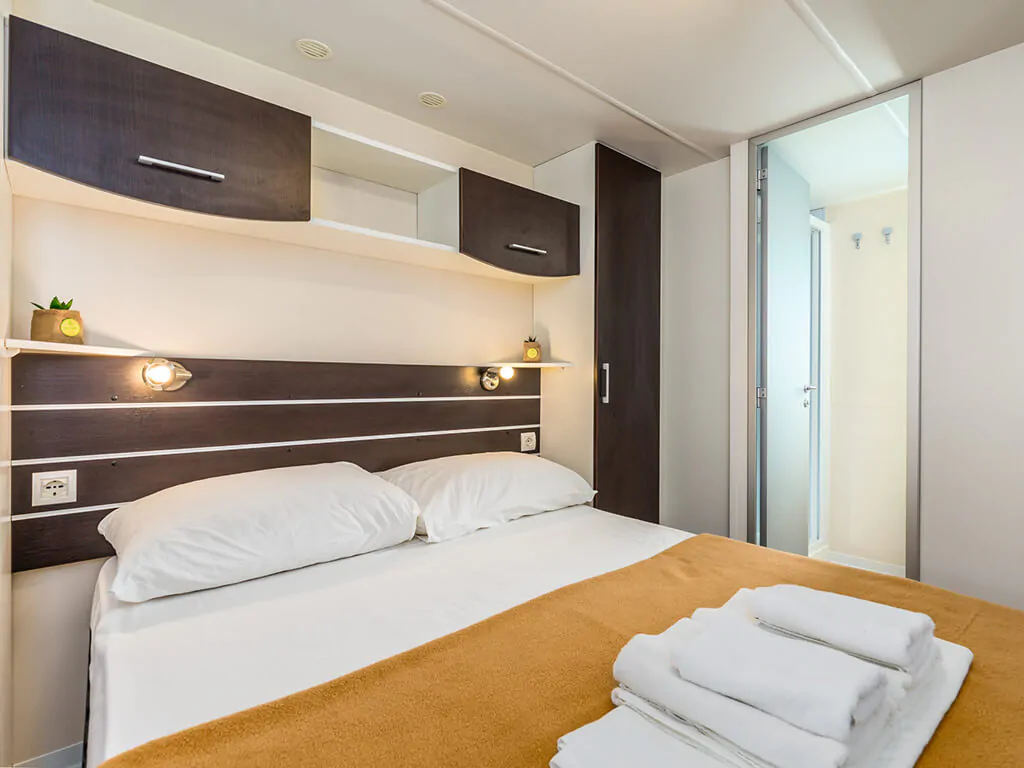 camping-strasko-bedroom-interior-of-adria-mobile-home-i-2
