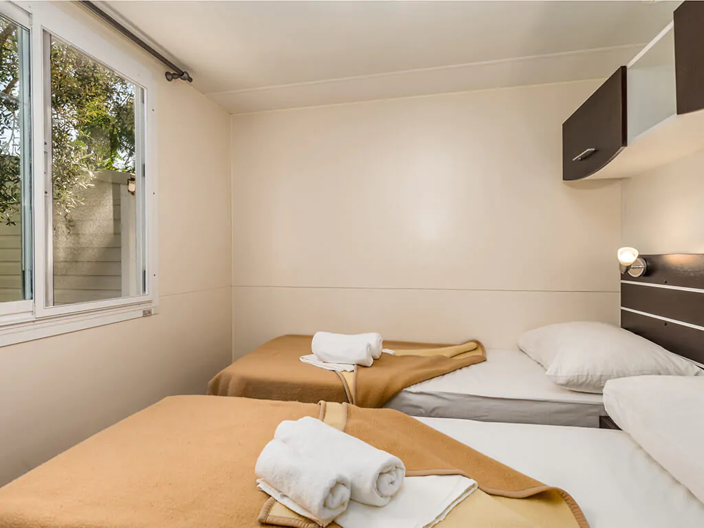 camping-strasko-bedroom-interior-of-adria-mobile-home-iii-2