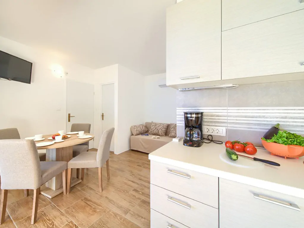 campsite-glavotok-luxury-villa-interior-kitchen-living-room-dining-table
