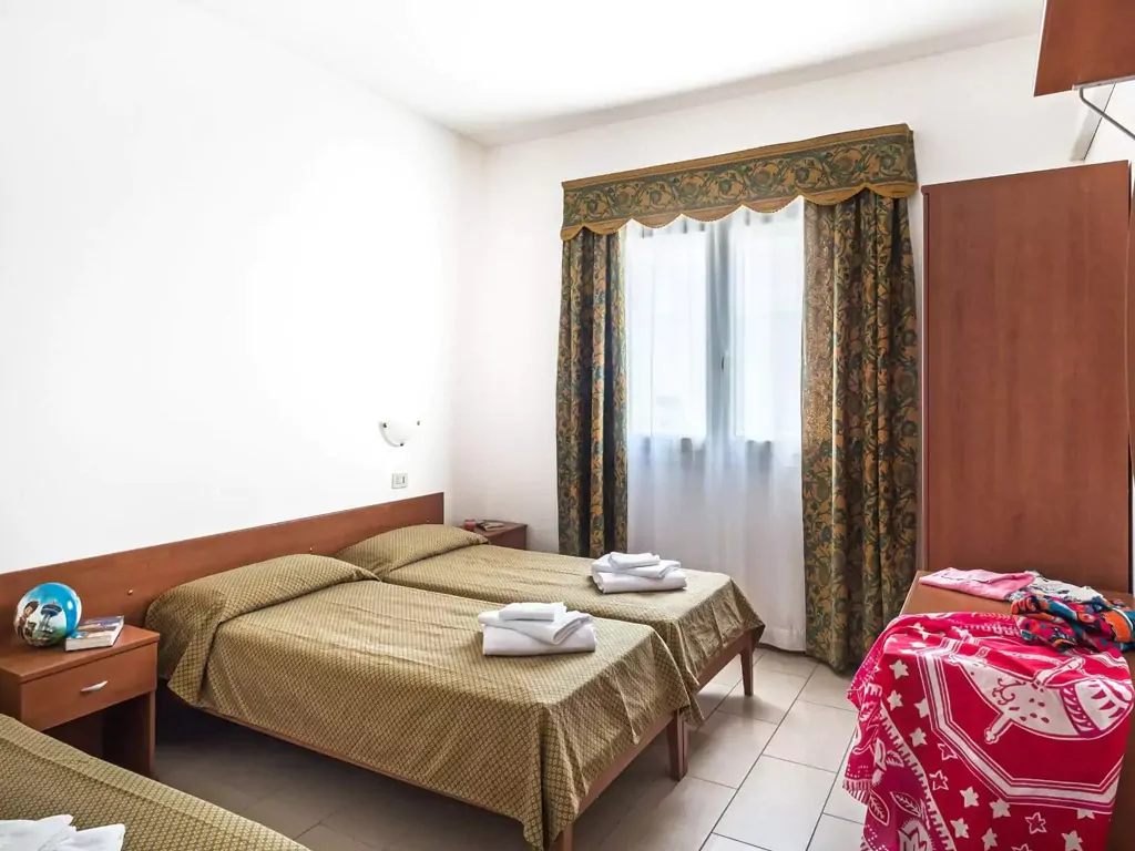 apartment-midi-villaggio-san-francesco-interior-single-beds