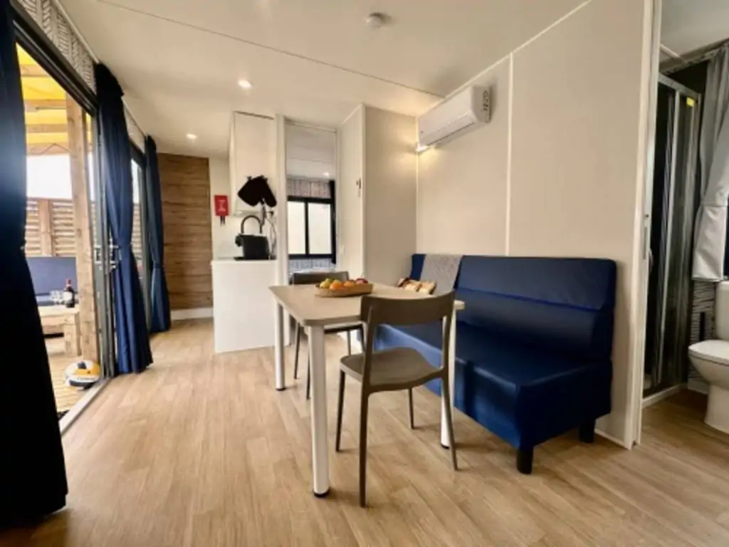 campsite-gasparina-estivo-premium-deluxe-living-room-and-table