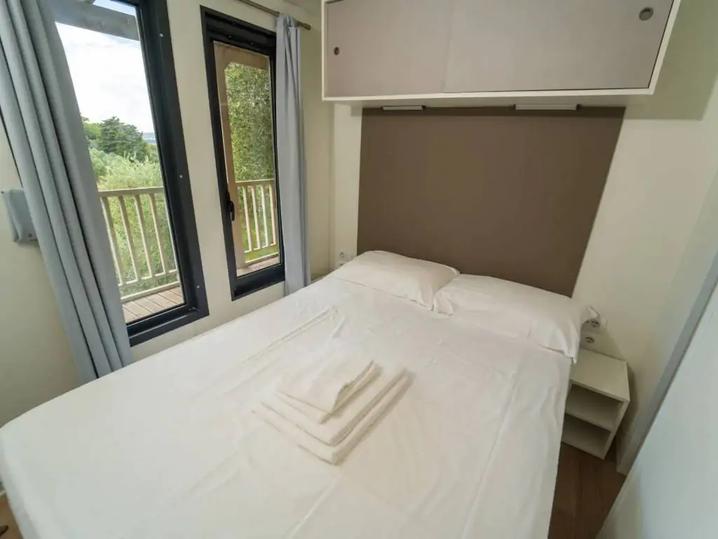 vallicella-glamping-resort-cottage-next-l-bedroom-with-double-bed