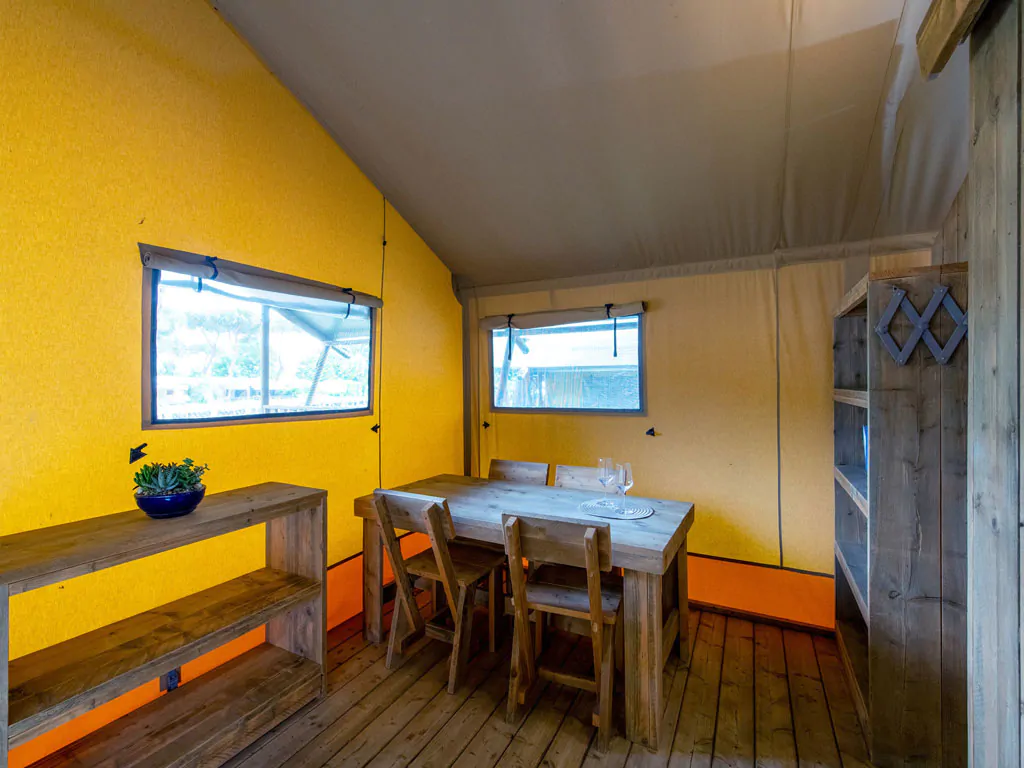 camping-village-punta-navaccia-glamping-tent-safari-lodge-tents-interior-dining-area