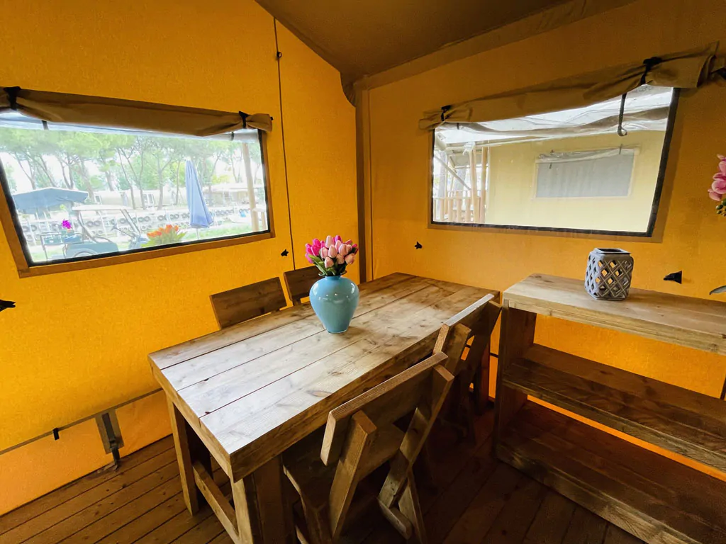 camping-village-punta-navaccia-glamping-tent-safari-lodge-tents-interior-dining-table